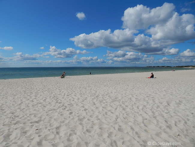 Nearly deserted beach on a warm, blue-sky day