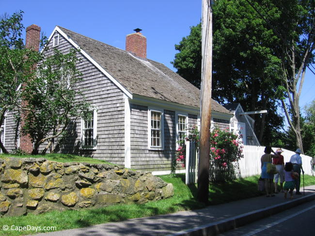 Family strolling along a sidewalk in Barnstable Village Family strolling along a sidewalk in Barnstable Village