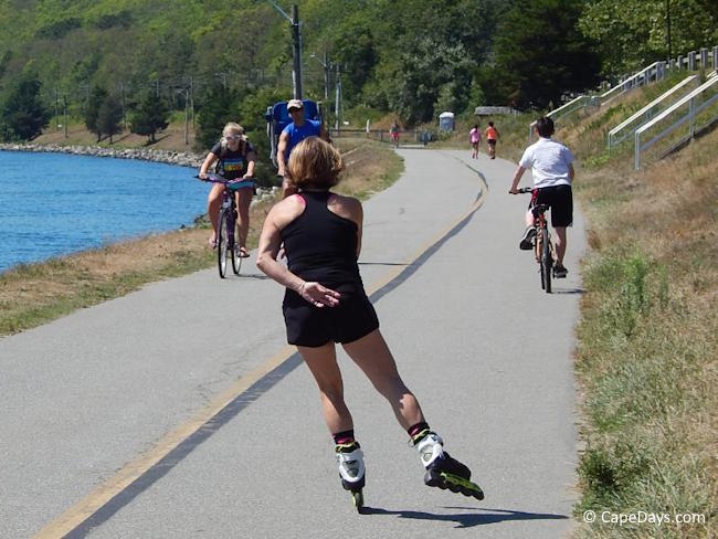 People biking, walking, and in-line skating along the Cape Cod Canal path