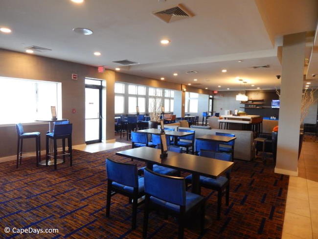 Restaurant area with tables of varying heights Restaurant area with tables of varying heights