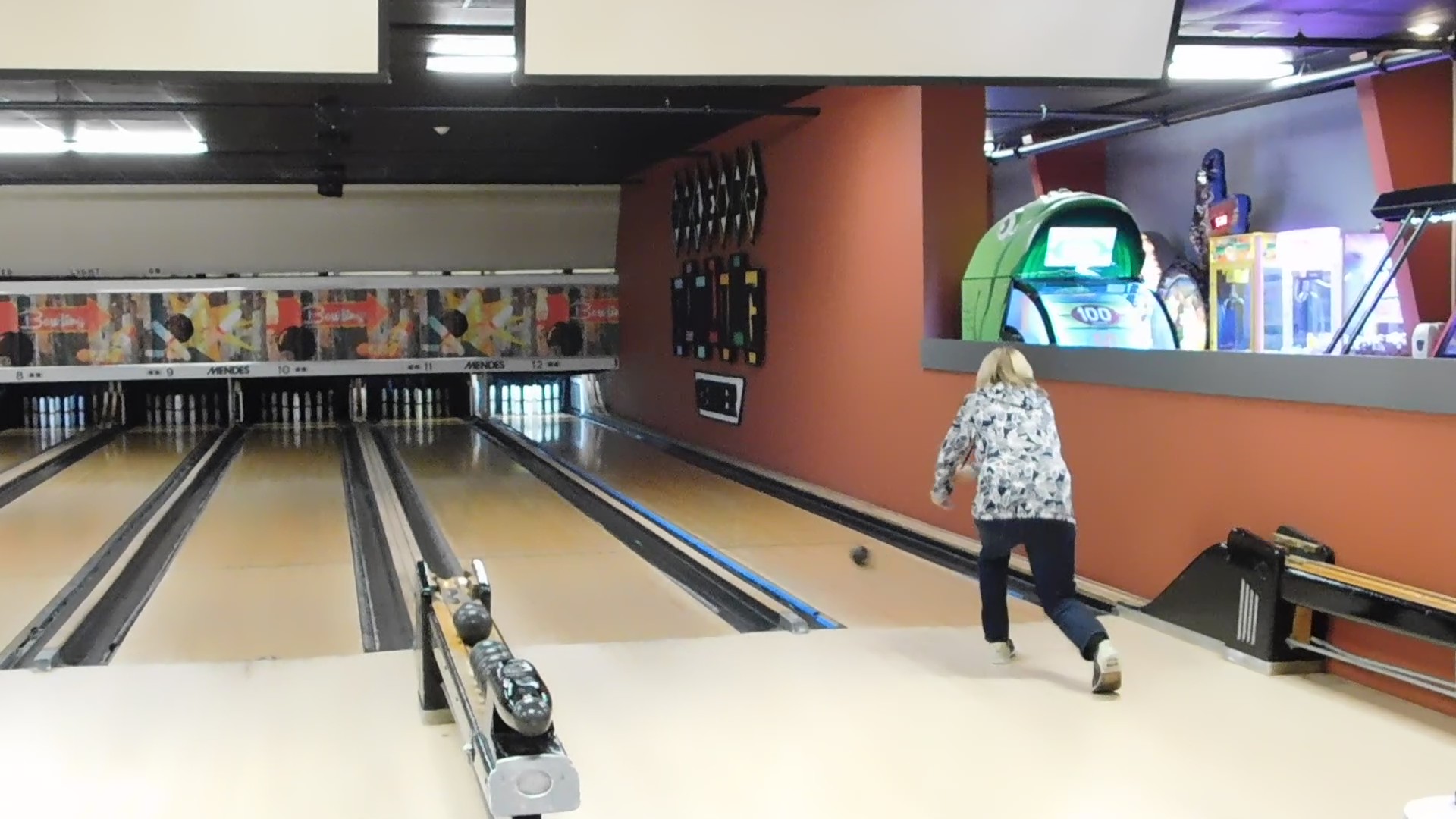 Woman candlepin bowling at The Alley Bowling & BBQ in Orleans