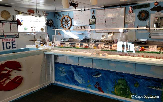 Interior of Andrea’s West Yarmouth Fish & Lobster, a Cape Cod seafood market selling fresh, local catches.
