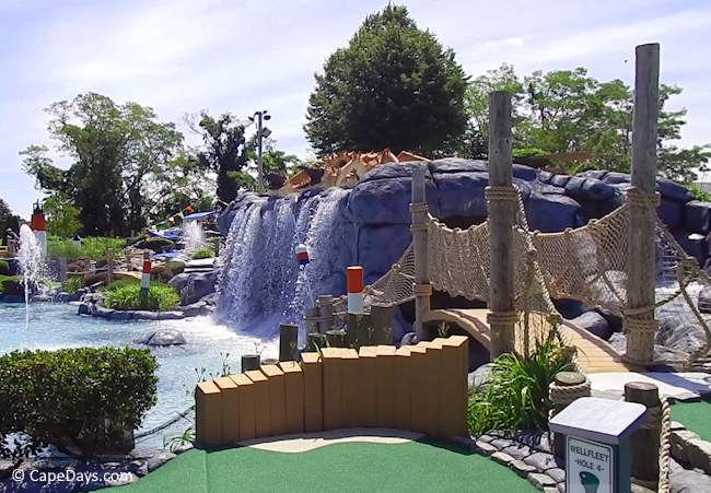 Waterfall and fishing-net bridge at Hole 4 of Cape Escape Mini Golf in Orleans, Cape Cod