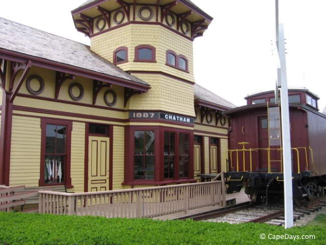 Railroad Gothic-style train museum with railroad car out front