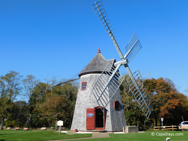 Eastham Windmill on the village green, with the door open to welcome visitors inside