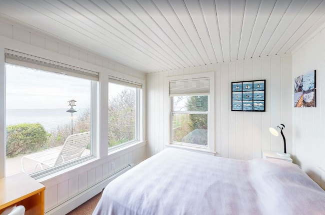 Bedroom with picture windows and views of Cape Cod Bay near First Encounter Beach