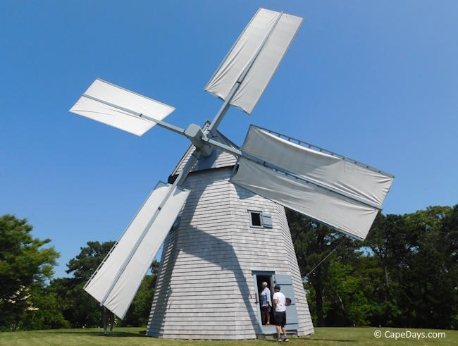Godfrey Windmill in Chatham with sails up and visitors entering the front door during a special-event open house