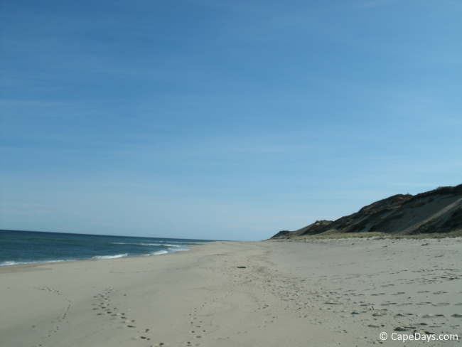 Footsteps in the sand on a deserted Head of the Meadow in Truro