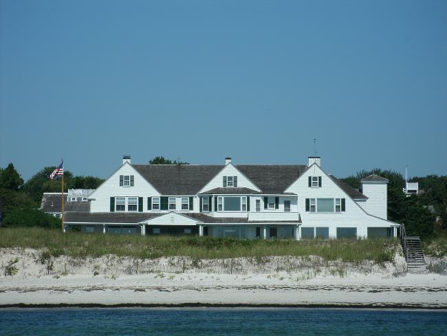 Sprawling, white, peaked-roof home on the Kennedy Compound overlooking the beach and Nantucket Sound waters in Hyannisport