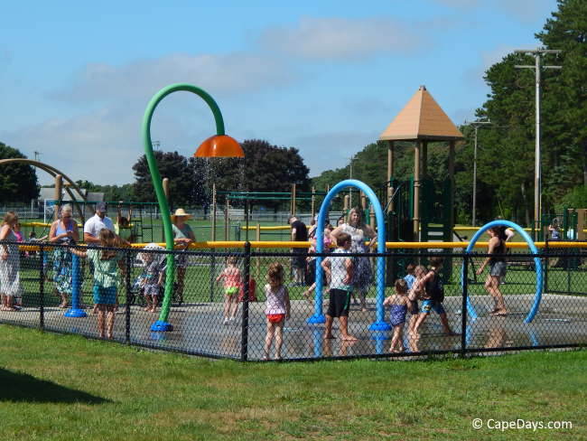 Family play time in the spray at Mashpee's splash pad