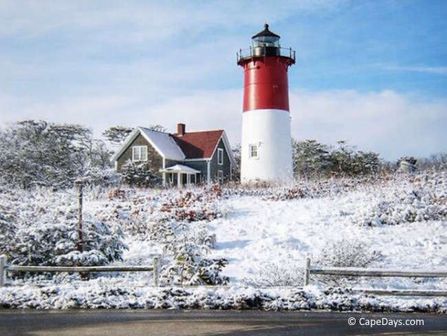 Nauset Light in Eastham on Cape Cod during winter with snow on the ground