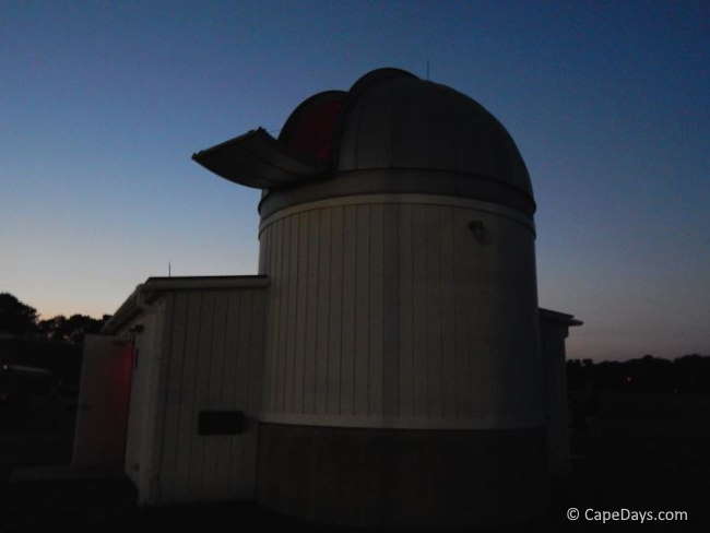 Observatory structure with dome open for viewing the night sky