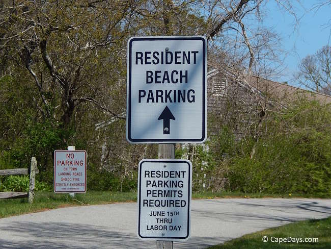Signage at beach entrance telling visitors that resident parking permits are required from June 15 through Labor Day