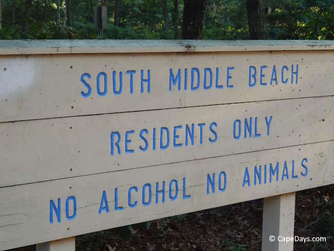 Sign at South Middle Beach in Yarmouth reading “Residents Only” with additional beach rules "No Alcohol. No Animals"