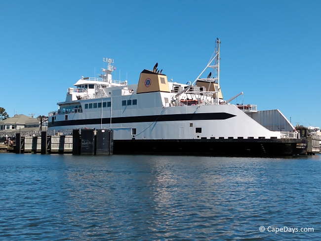 Large white and black ship at dock