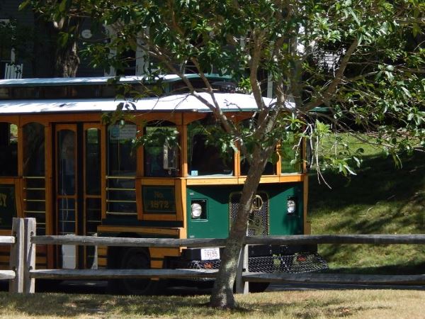 Trolley stopping to pick up passengers Trolley stopping to pick up passengers