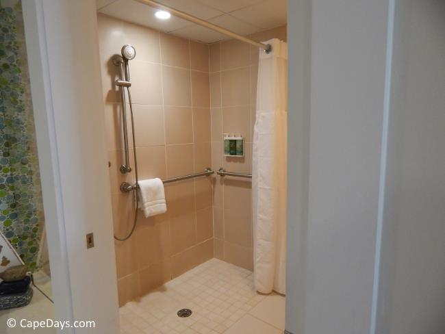 Roll-in shower with safety bars