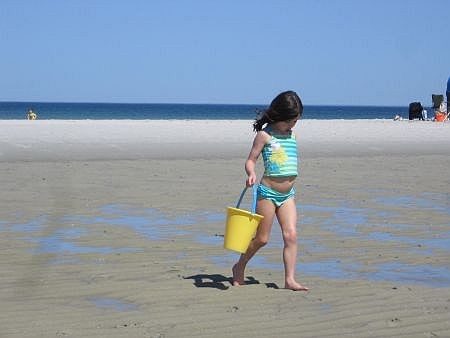young girl on a cape cod bay beach